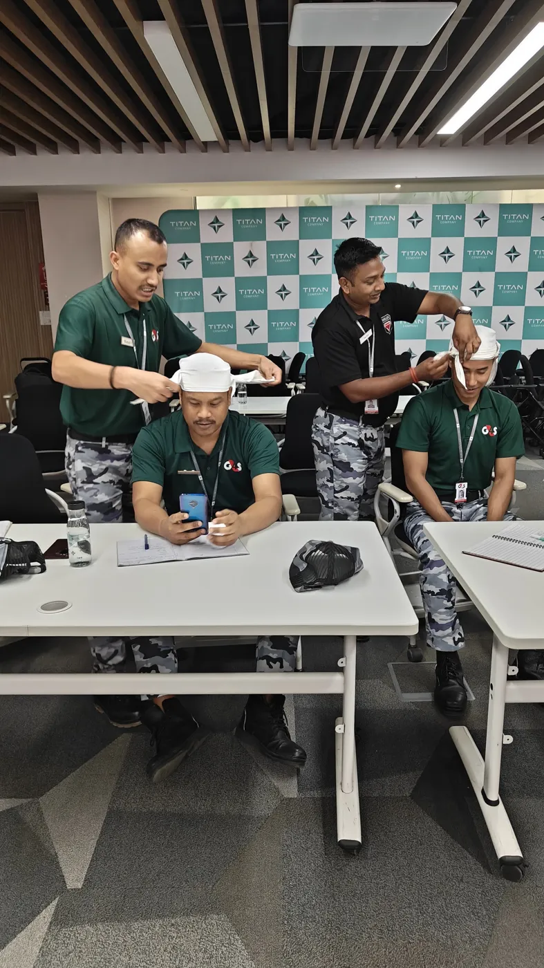 Head bandaging demonstration during first-aid training