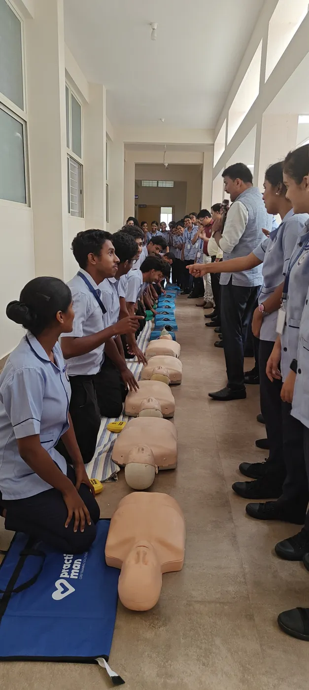 Nursing students practising CPR on manikins