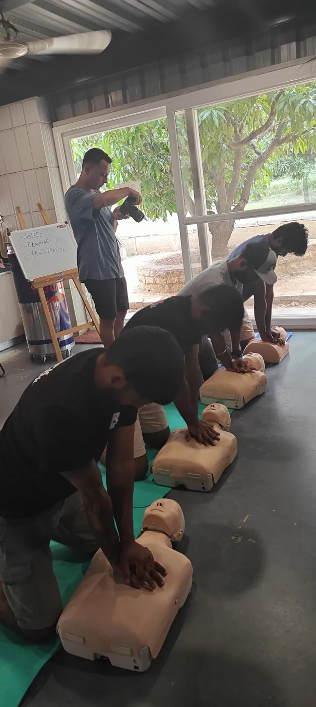 Outdoor CPR practice on a manikin