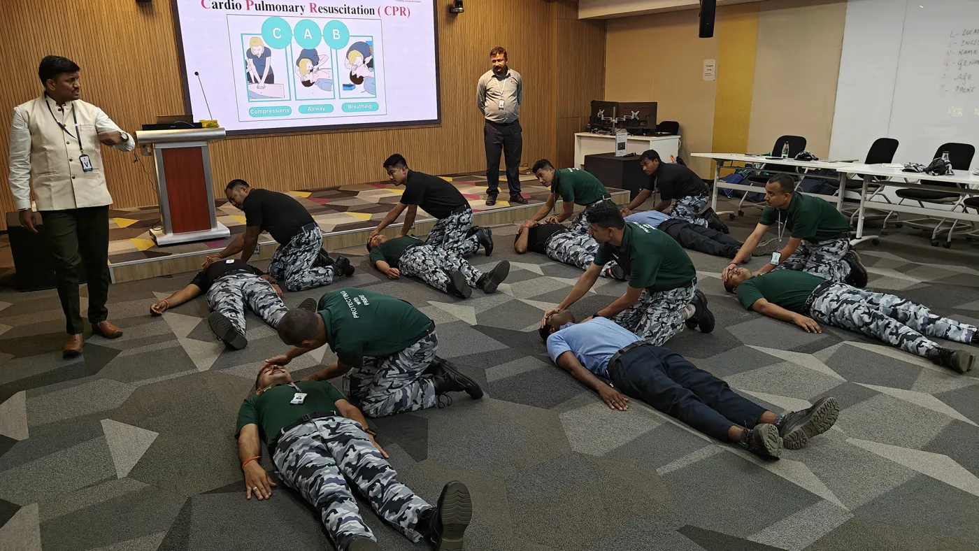 Group practising the recovery position together