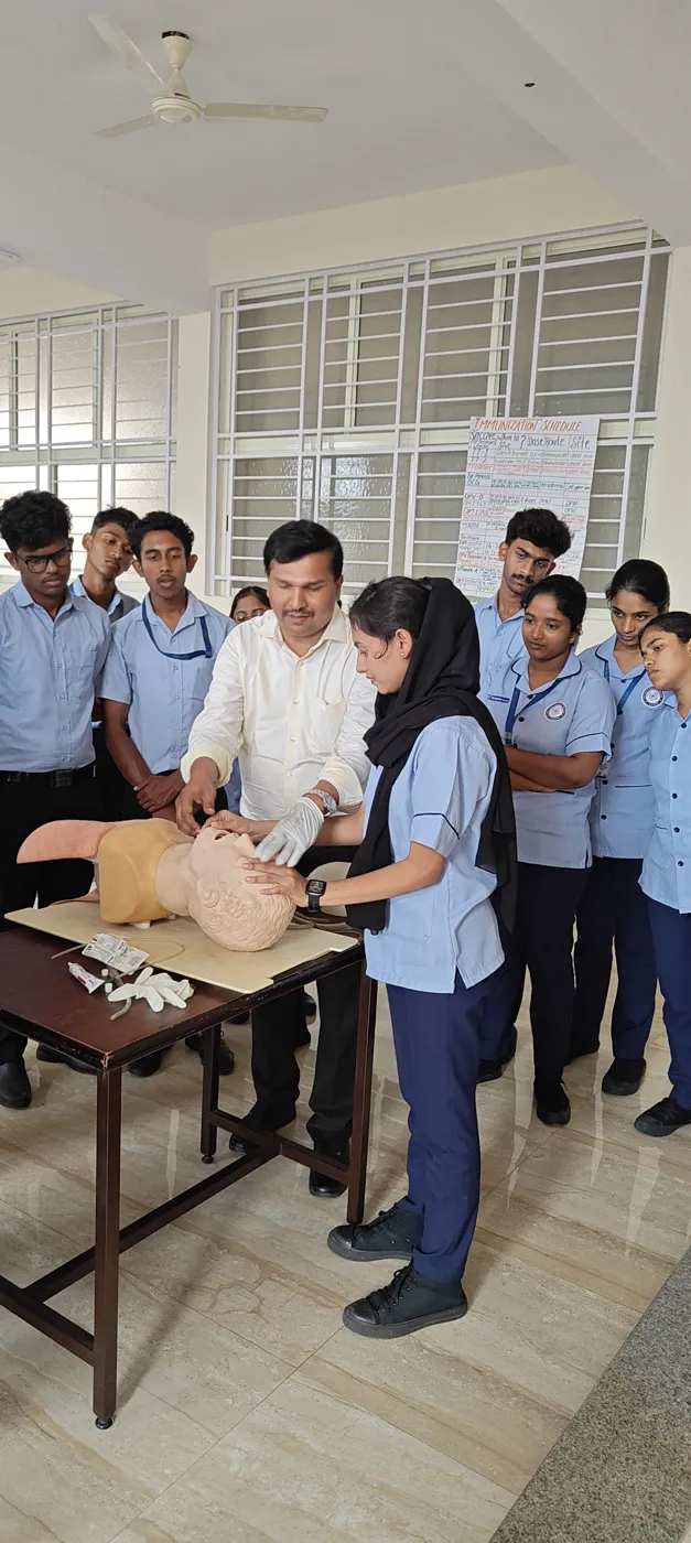 Student demonstrating first-aid technique in class