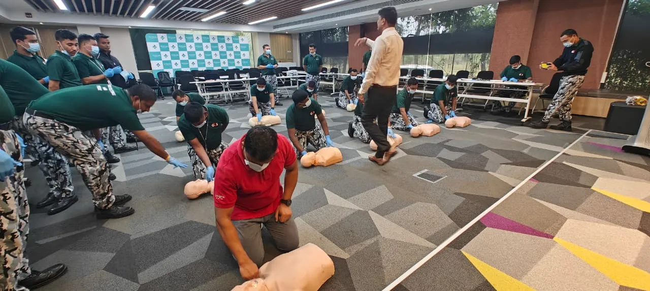 Trainees practising chest compressions together