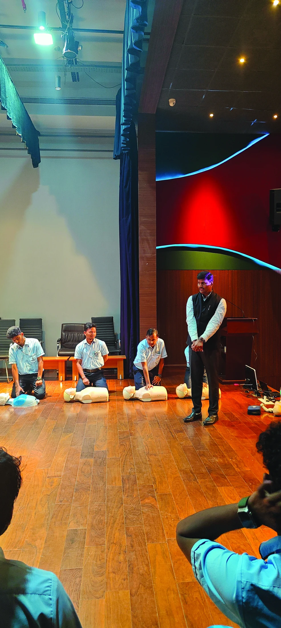 Instructor leading a hands-on CPR training session