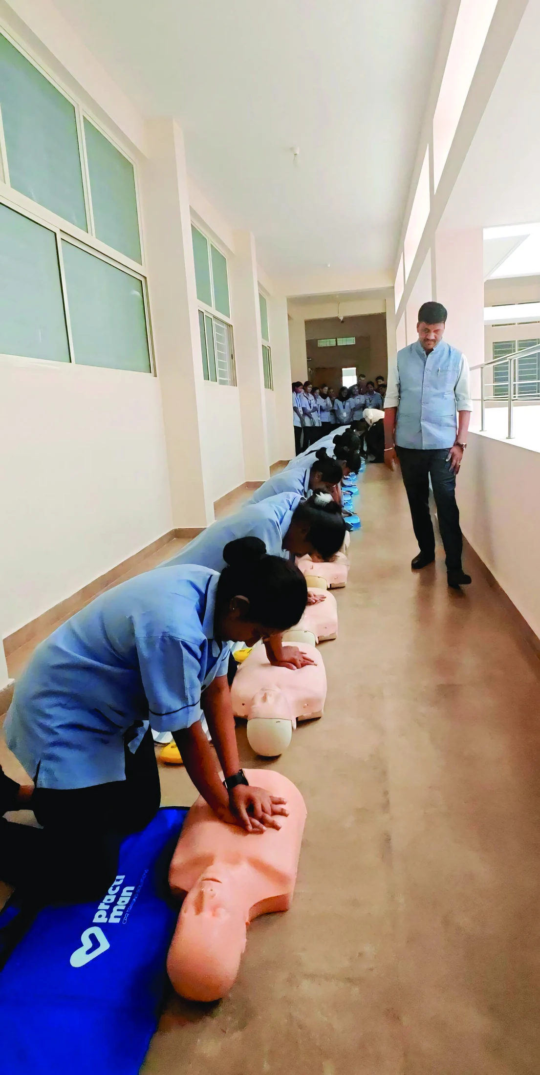 Students practising chest compressions on mannequins